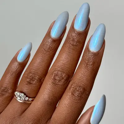 medium-long icy blue chrome nails with rounded tips