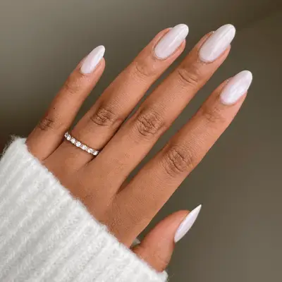 Oval nails with icy blue shampagne nail polish.