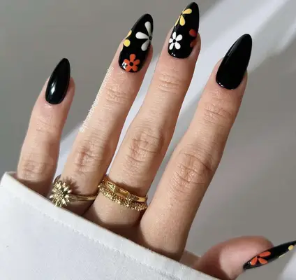 black nails with floral accents