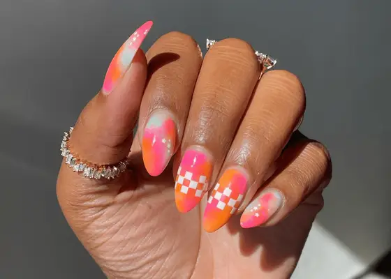 neon watercolor effect nails, plus checkerboard accent nails