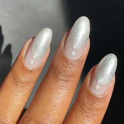 a frosty silver manicure with pearl accents
