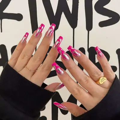 Pink and silver heart nails, viewed close up