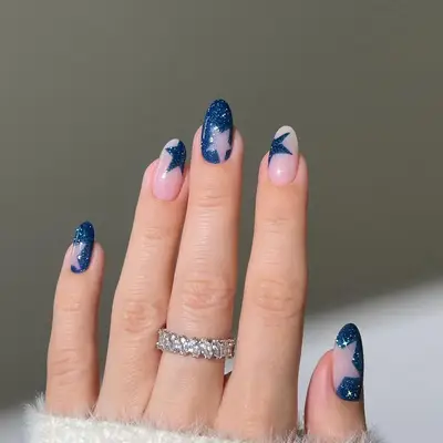a shimmery blue velvet manicure with star cutouts