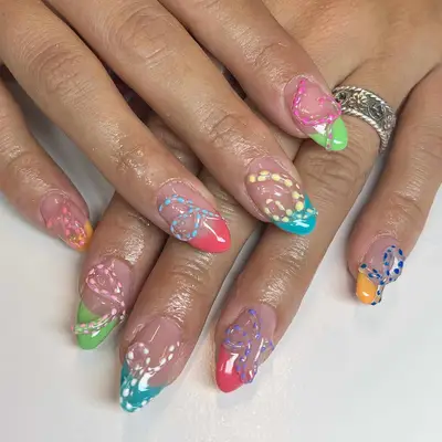 Spotted tentacle gel manicure with mismatched French tips