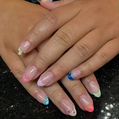 Mismatched French tip manicure with variety of patterns