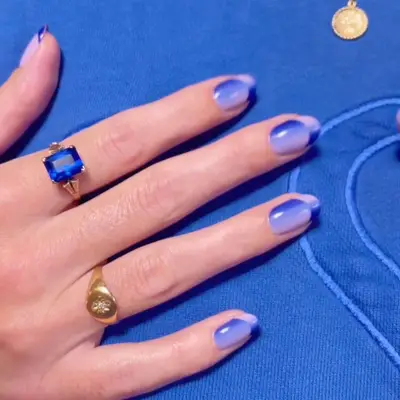 Optical illusion periwinkle purple and blue manicure with reverse gradient French tip