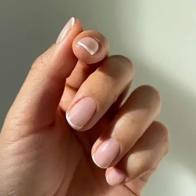 Close up of a short French manicure