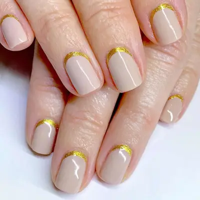 Beige nails with gold cuff