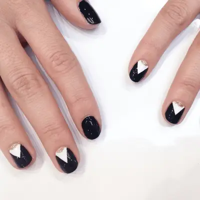 Matte black nails with gold foil