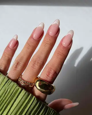 A French manicure with pearlescent white tips