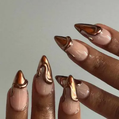 A French manicure with brown chrome tips