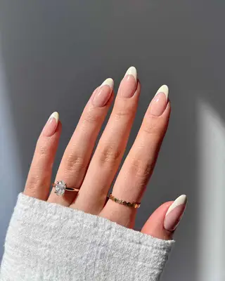 A French manicure with off-white tips
