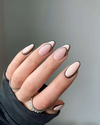 Close up of a pop-art manicure with French tip accent nails