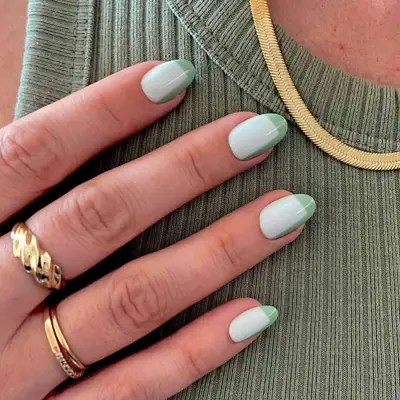Mint manicure with green minimalist angled design