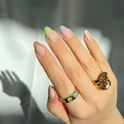 Manicure with multicolored pastel drip French tips