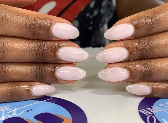 acrylic manicure with rose colored nails