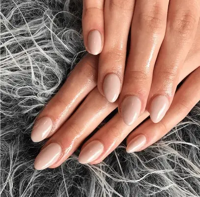 short acrylic manicure with rounded nude nails