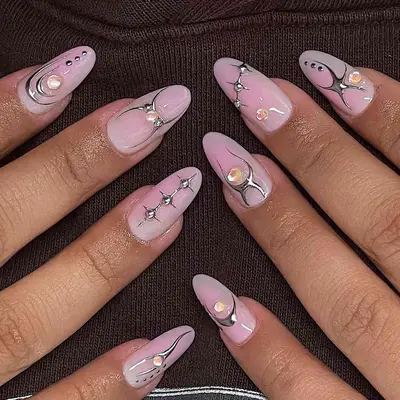 Intricate nail art design on manicured nails