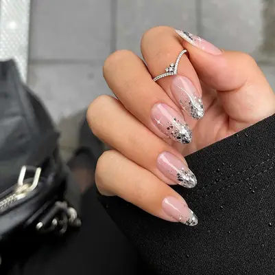 Silver starry French manicured nails