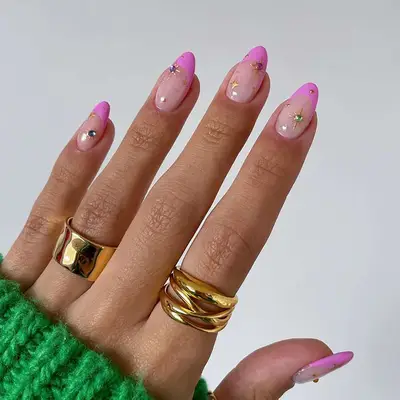 Pink French manicure with sparkling gem details