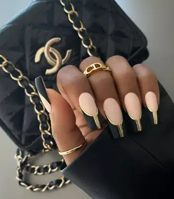 A gold and black French manicure.