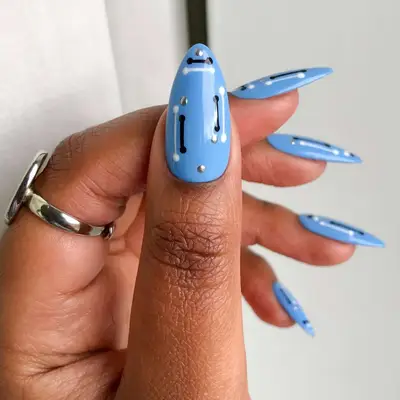 Cornflower blue nails with black and white designs