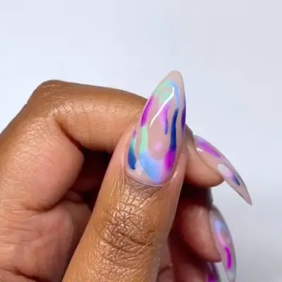 a sheer manicure topped with abstract ombre art