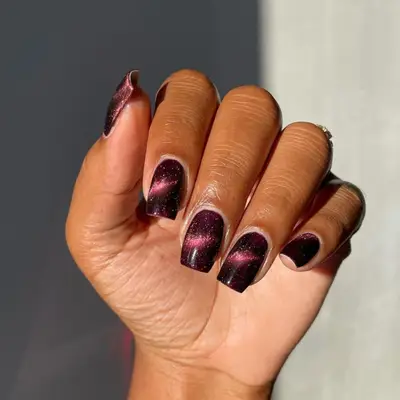 Magnetic black cherry manicure.