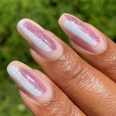 Bubble bath pink nail with sparkling strips of white and pink in the center of each nail.