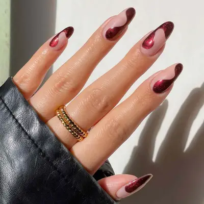 burgundy swirl chrome nail art 