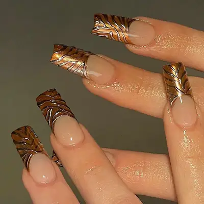 gold and silver animal print french chrome nails