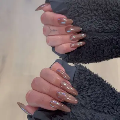 brown glazed donut nails on long almond shaped tips