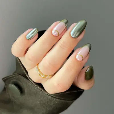 green and gold nail design on medium length almond nails