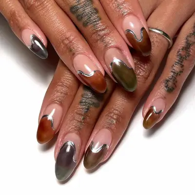 gray, brown, and black chrome nails with silver detailing