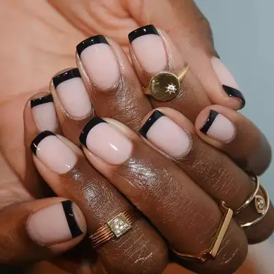 Square nails with a black French tip.