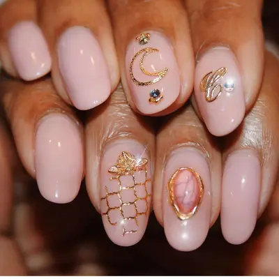 pinky nude nails with gold charms