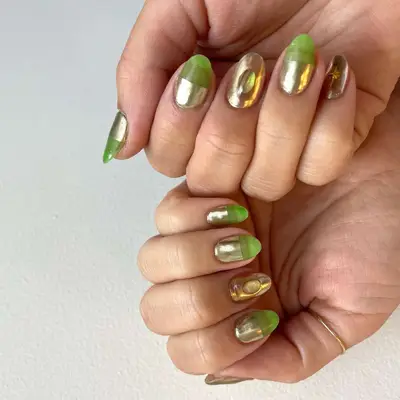 Manicure with part-gold chrome, part-green jelly base and dewdrop accent designs