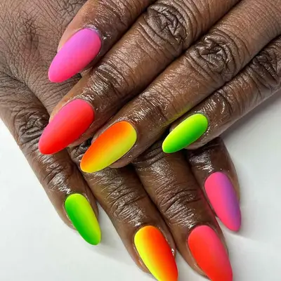 Hands with stylish matte ombre nail colors