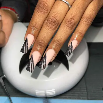 Matte nails with glittery black stripes