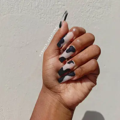 Glitter cow print nails