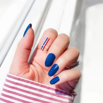 Cobalt blue manicure with simple striped accent nail