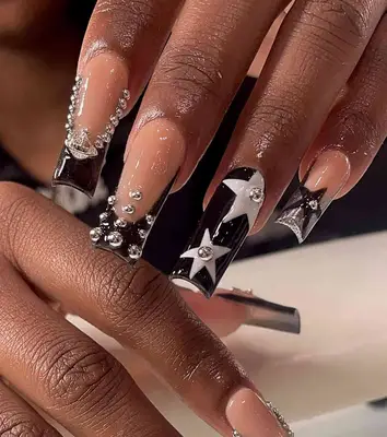 Black and white nail art with silver studs