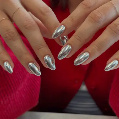 Close up of high-shine silver chrome nails.