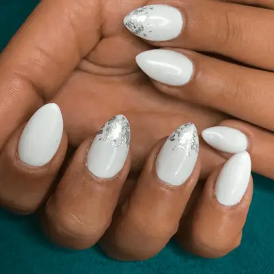 Frosty white manicure with silver-dipped tips