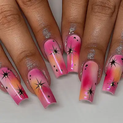 prange and pink aura nails long square shape with gold stars