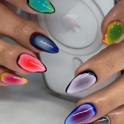 aura nails with different colors on each finger