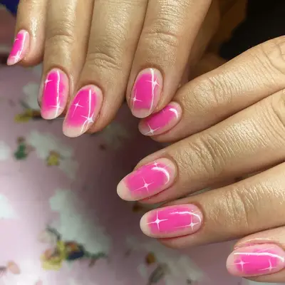 short pink aura nails with twinkle star design