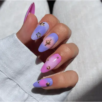 matte pink and purple press-on aura nails with gold gems