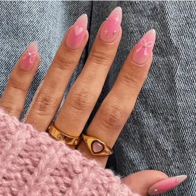 dainty pink aura nails with ribbon heart and star art
