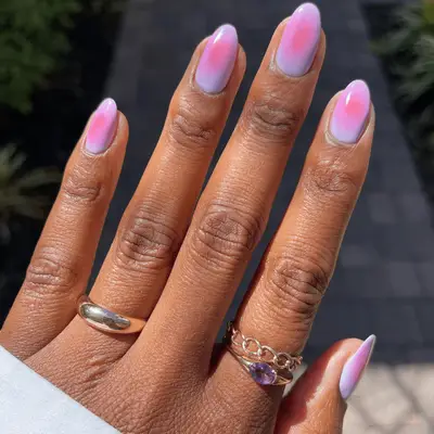 Orange-red center rounded aura nails with lilac base